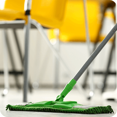 Photo of mop on a classroom floor