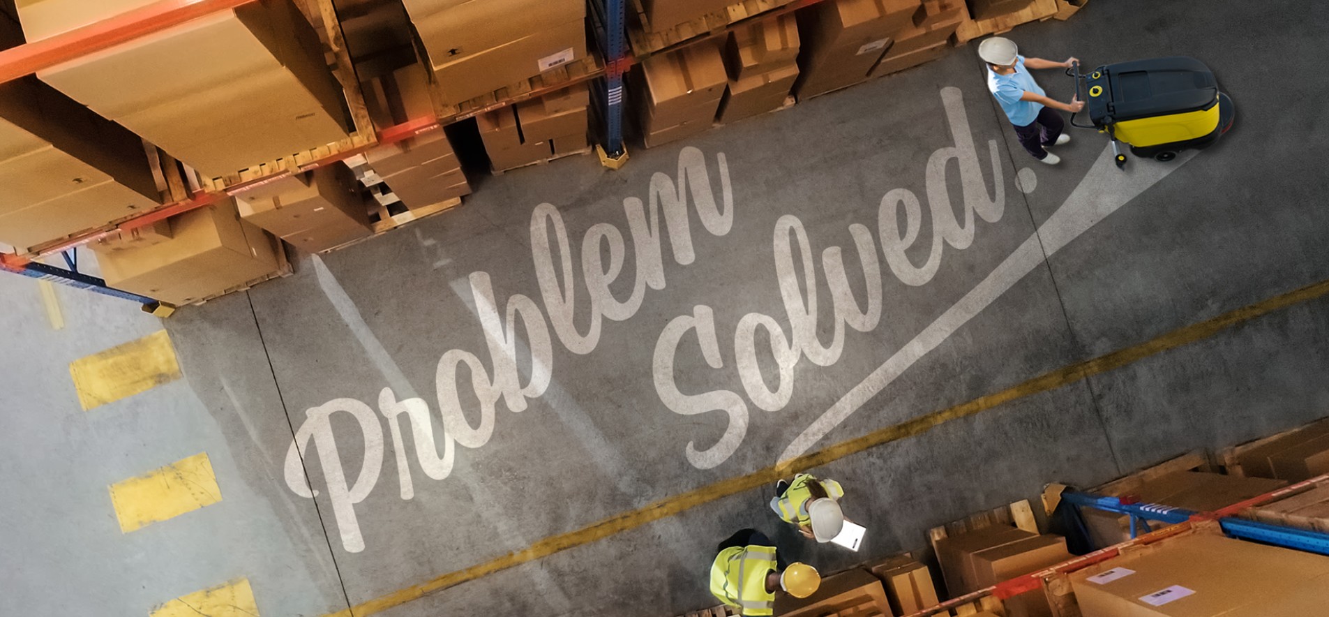 The words "Problem Solved" appearing on the floor of a warehouse