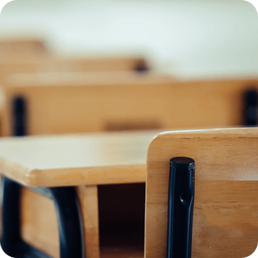 Photo of desks and chairs in a schoolroom